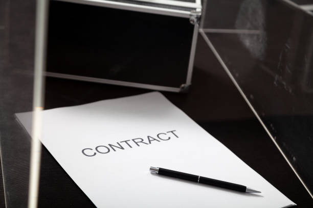 istock Contract and case for money lies in transparent box 1223841596