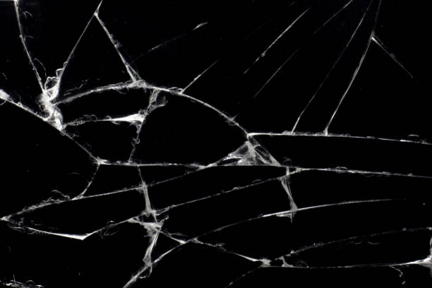 istock Broken black glass, with white lines on black glass. 1223841637