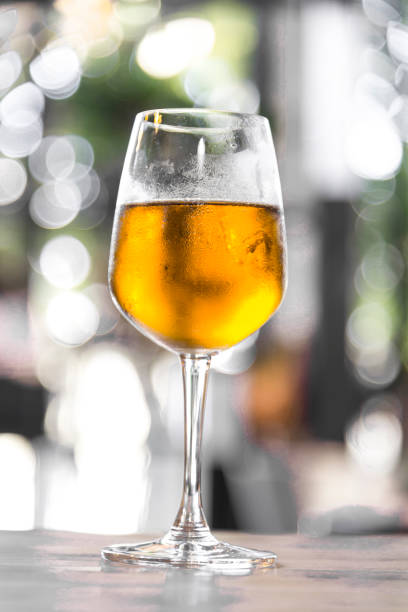 istock Ice beer on glass with blur natural bokeh background 1223842244