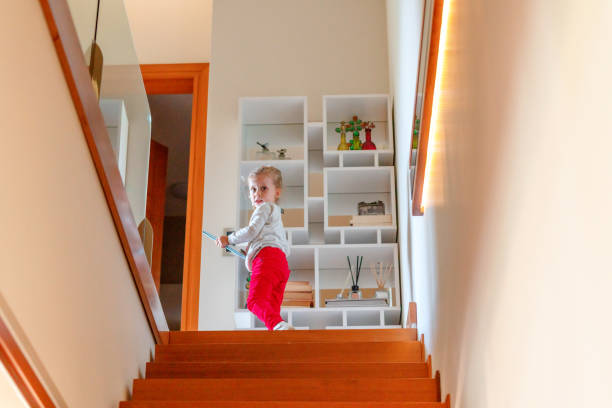 istock Little girl walking up stairs 1223842612