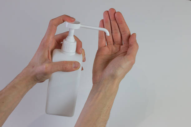 istock Male person doing hand washing with hydroalcoholic solution to eliminate germs and coronavirus 1223842631