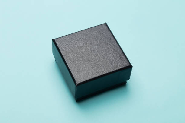 istock Mini black box product packaging isolated on blue background 1223843577