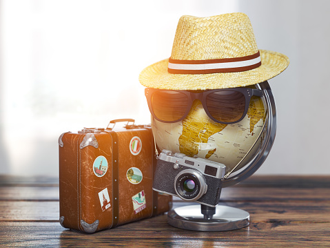 Tourism and travel concept. Globe with summer hat, sunglasses photo camera and vintage suitcase. ready to trip. 3d illustration
Map of the world was created me in Adobe Illustrator.