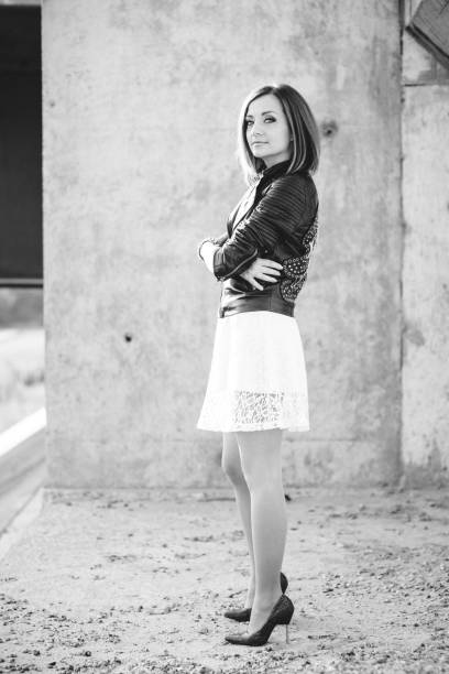 istock red-haired girl in a black jacket and blue glasses 1223844140