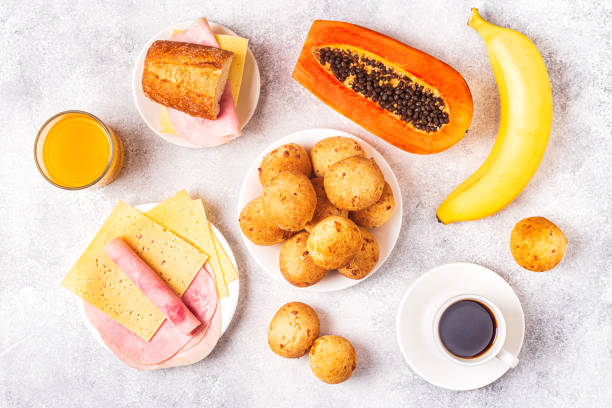 istock Traditional Brazilian breakfast - cheese bread, coffee, ripe fruit, top view 1223845011
