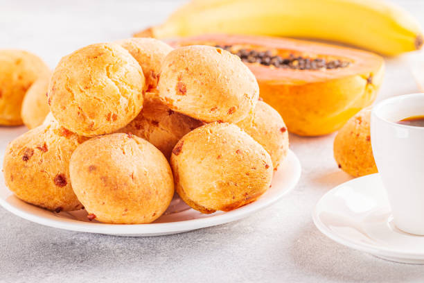 istock Traditional Brazilian breakfast - cheese bread, coffee, ripe fruit, selective focus 1223845051