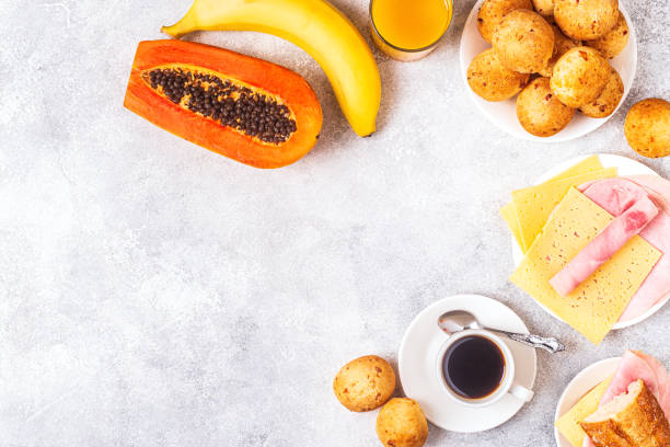 istock Traditional Brazilian breakfast - cheese bread, coffee, ripe fruit, top view 1223845125