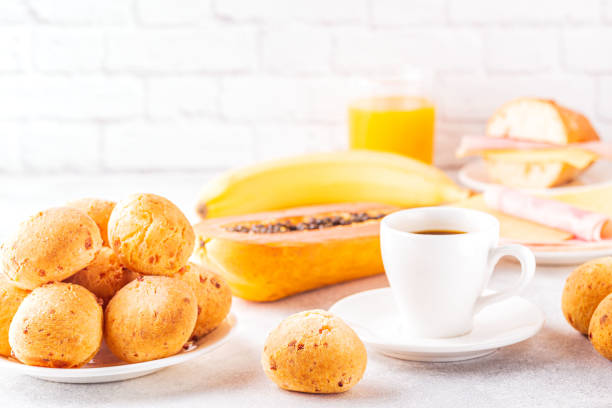 istock Traditional Brazilian breakfast - cheese bread, coffee, ripe fruit, selective focus 1223845202