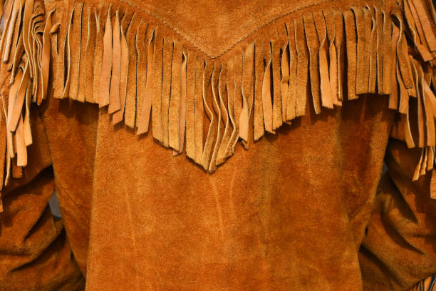 Vintage Style Leather Coat An image of an old vintage style leather coat with long fringes. fringe stock pictures, royalty-free photos & images