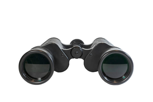istock Big black binoculars isolated over white background. Front view. The sky is reflected in the lenses. 1223847383
