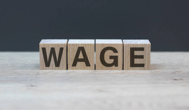 istock concept word WAGE on cubes on a wooden background 1223847436