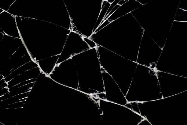 istock Broken black glass, with white lines on black glass. 1223849430