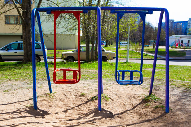 istock Empty swings in the yard. Empty playground, quarantine concept 1223855394