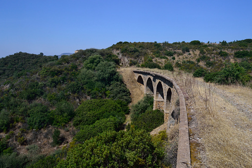 Maglova Aqueduct (Turkish: Maglova Kemeri on Alibey deresi) in Kemerburgaz City Forest. Istanbul, Turkey. Aqueduct built by Mimar Sinan. Kemerburgaz Urban Forest with a total area of ​​5,500,000 square meters; With its sports fields, cafes and restaurants, children's playgrounds, hiking trails, activities and festival areas for children and all families, it is the meeting point of culture, art, sports and entertainment where all Istanbulites can spend 365 days as a family.