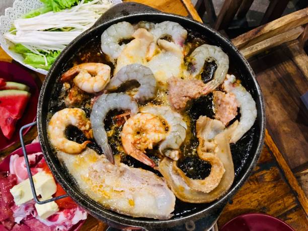 Prawns and butter grilled on a hot pan.