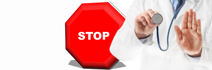 Stop sign and doctor hand doing prohibition sign. Doctor warning about diseases. Health care.
