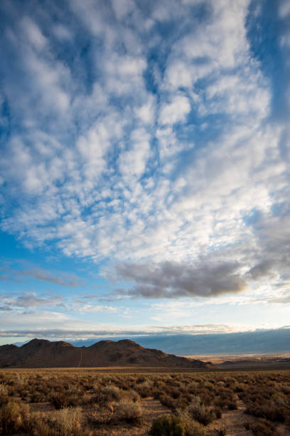 istock clouds over desert, hills and mountain landscape 1223864573