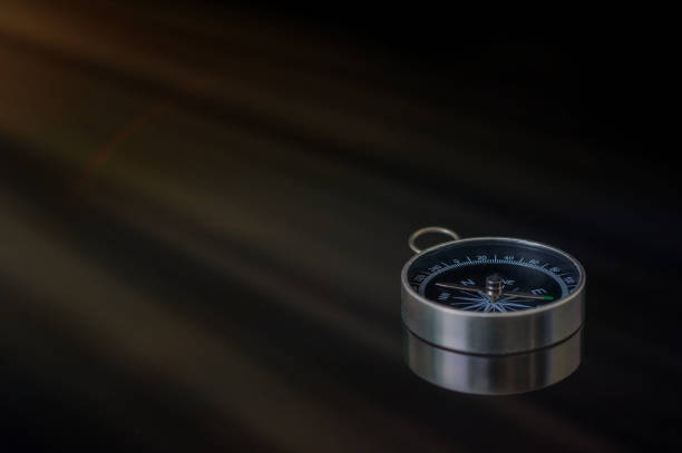 istock Compass on a black background. Concept - compass showing the right direction 1223868451