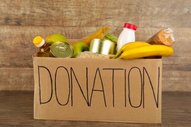 istock Donation box with food on the broun background 1223870670
