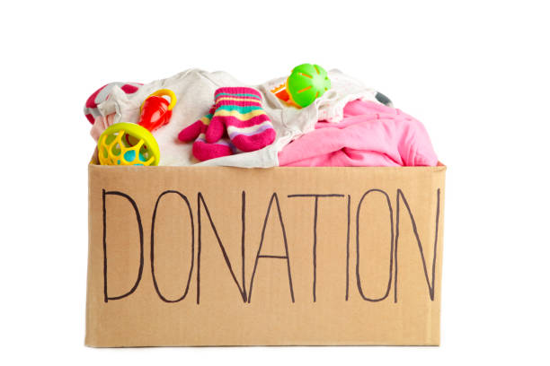 istock Donation box with baby clothes isolated on white background 1223870758