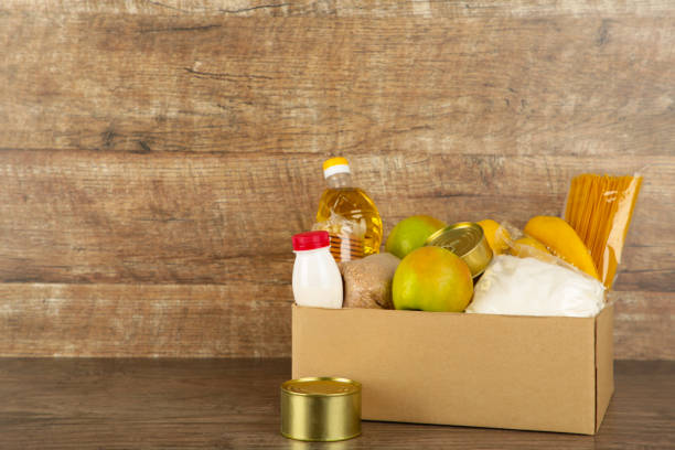 istock Donation box with food on the broun background 1223870968