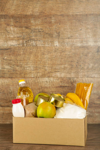 istock Donation box with food on the broun background 1223871044