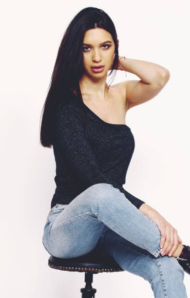 istock Beautiful, stylish brunette female model posing in studio on isolated background. 1223875520