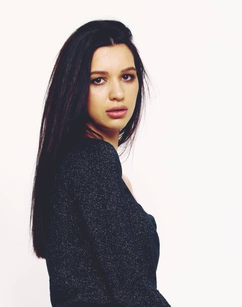istock Beautiful, stylish brunette female model posing in studio on isolated background. 1223875534