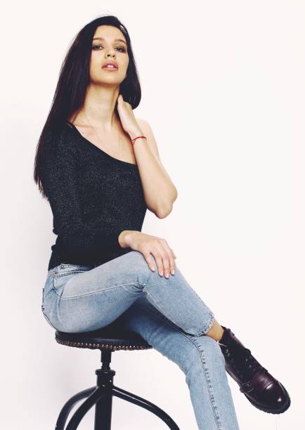 istock Beautiful, stylish brunette female model posing in studio on isolated background. 1223875541