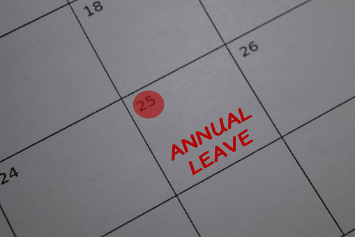 Annual Leave write on calendar. Date 25. Reminder or Schedule Concepts