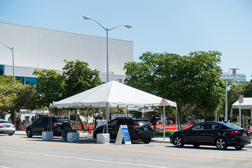 Miami Beach, FL USA - May 9, 2020 - A COVID-19 drive through testing site in front of the Miami Beach Convention center.