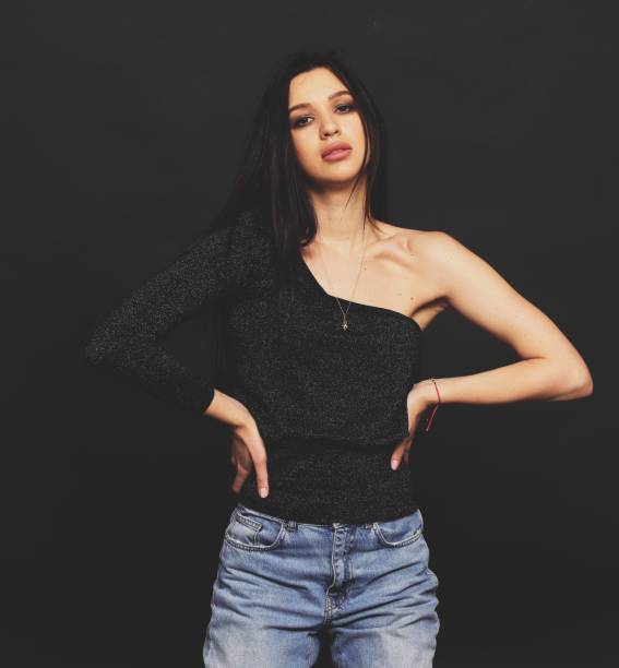 istock Beautiful, stylish brunette female model posing in studio on isolated background. 1223877843