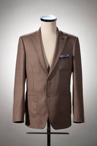 istock Men's clothing, brown jacket on stand. 1223878917