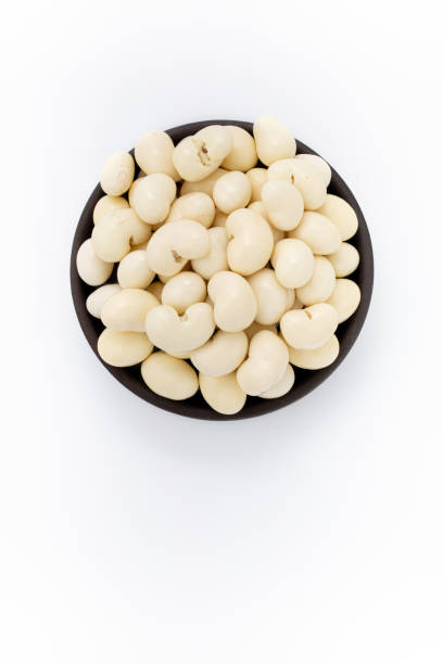 istock Yogurt Cashew nuts in round bowl on white background, top view 1223879060