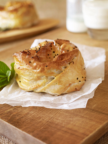 Rolled Turkish pastry borek on a table setting