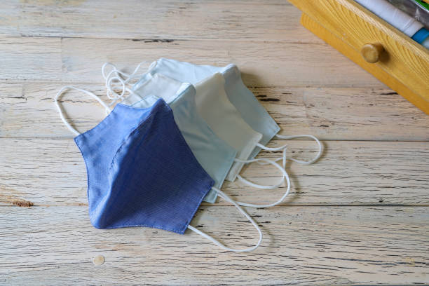 istock handmade cloth mask on the wooden table 1223880796
