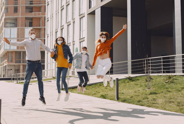 istock People in a mask standing on the street 1223880812