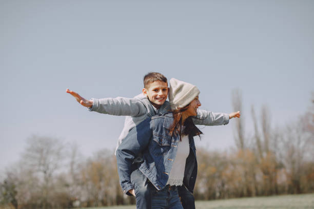 istock Mother with children in a spring city 1223880913