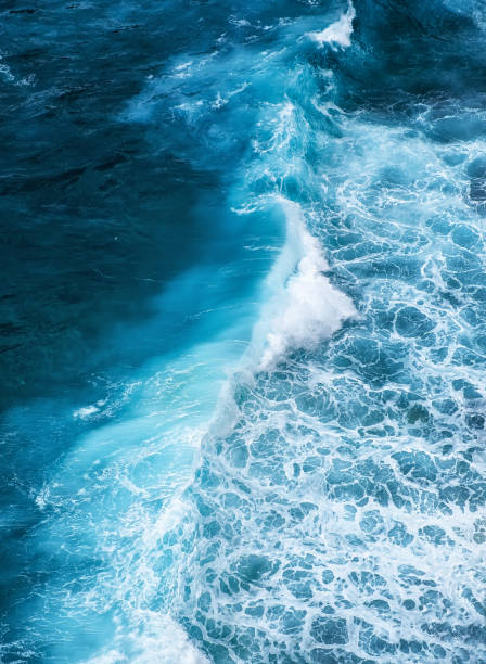 istock Waves and blue water as a background. View from high rock at the ocean surface. Natural summer seascape. Water background. Bali, Indonesia 1223881918