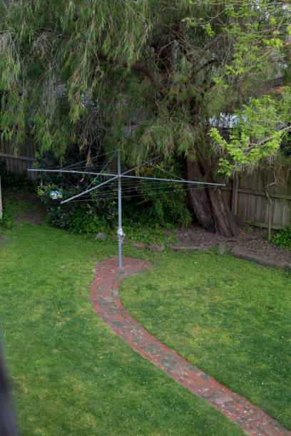 An old, iconic Hills Hoist in an Australian backyard.