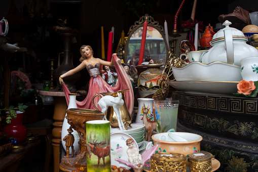Old vintage objects and furniture for sale at a flea market