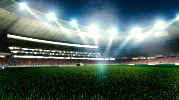 ライトのナイトフットボールアリーナがクローズアップ。サッカースタジアム。 - soccer field flash ストックフォトと画像