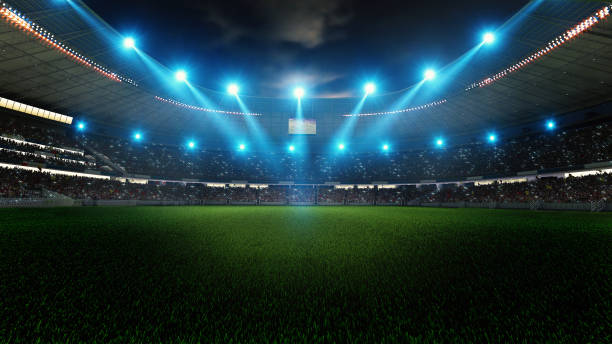 ライトのナイトフットボールアリーナがクローズアップ。サッカースタジアム。 - soccer field flash ストックフォトと画像