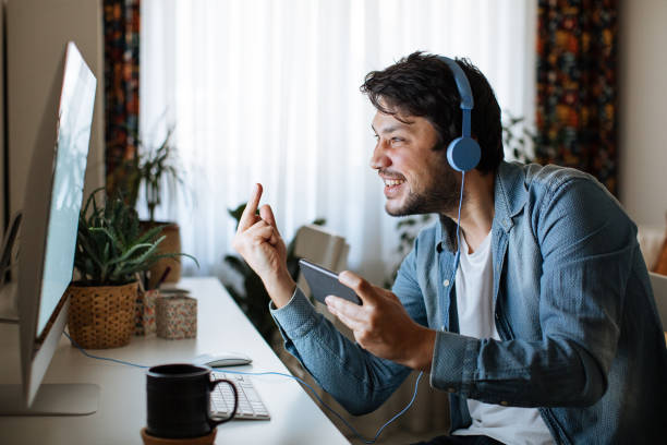 istock Young men playing video games with desktop 1223886969
