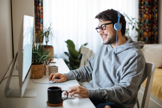 young men working from home - online game imagens e fotografias de stock