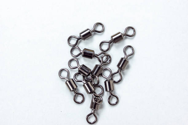 istock fishing carabiners on a white table 1223888735