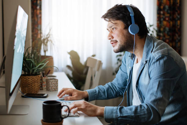 istock Young men playing video games with desktop 1223889044