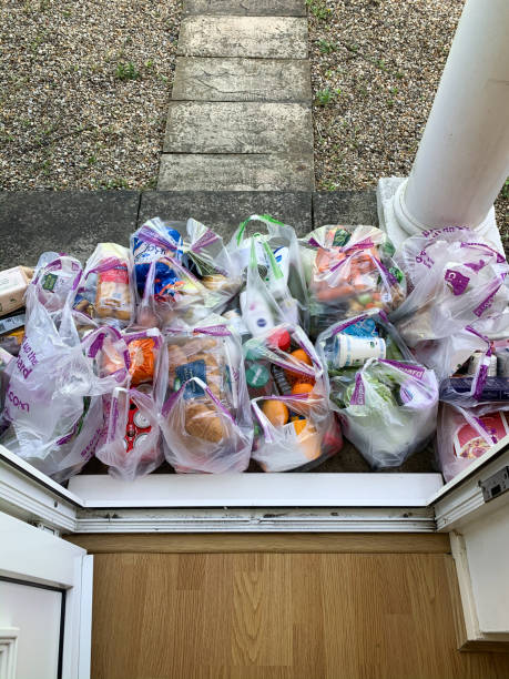 Supermarket shopping delivery Oxfordshire, England - April 14, 2020: Food groceries delivery from ASDA are left outside at resident's door during Coronavirus pandemic asda photos stock pictures, royalty-free photos & images