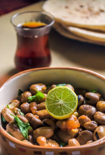 istock Ful Medames -  Egyptian fava beans with red tea 1223892242