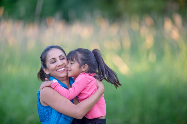 istock Hispanic mother and daughter enjoying nature 1223893969